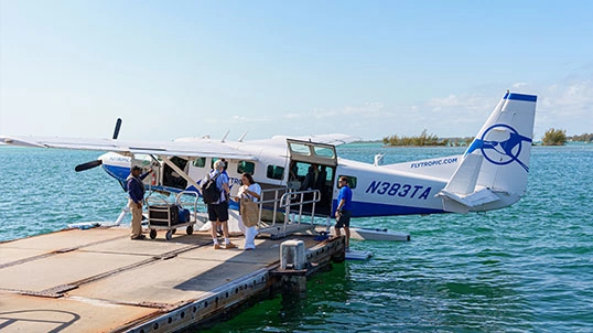 blade-sec-img-02 Passengers boarding a seaplane at a dock before departure
